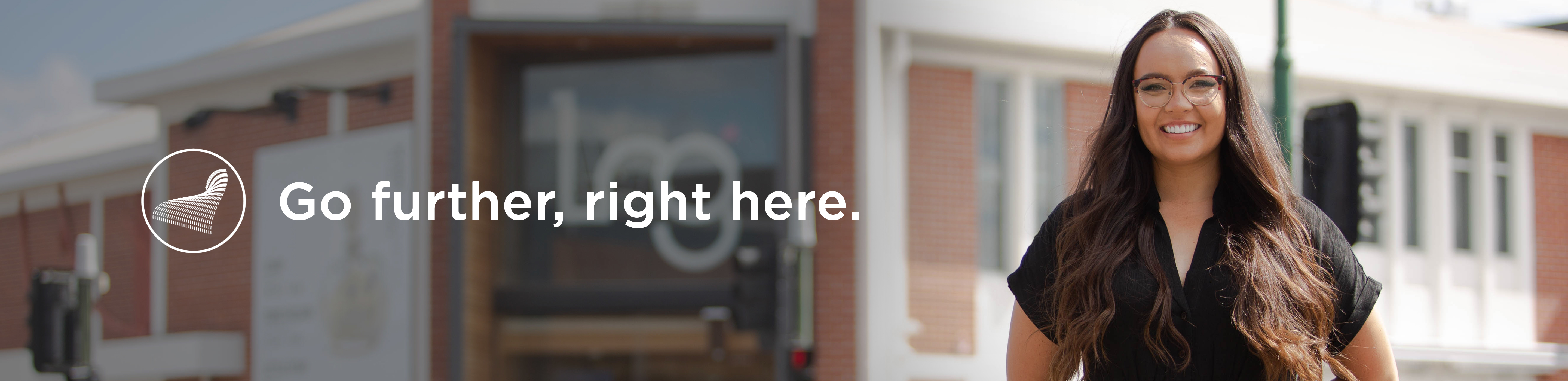 Go further, right here. Image of person smiling.