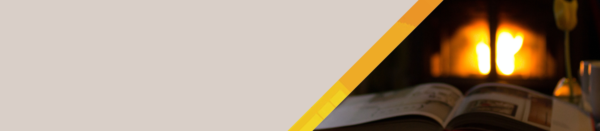 Web banner showing an image of a fireplace in the background and a book in the foreground.