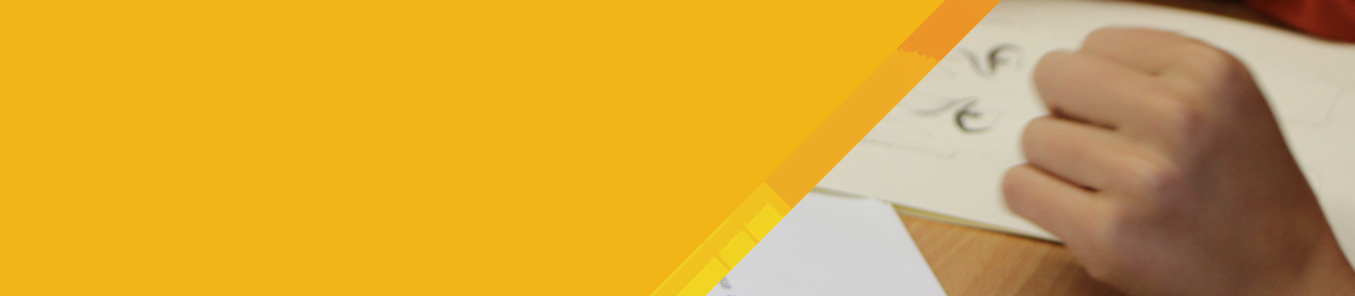 Graphic showing a child's hand drawing cartoon eyes on a white piece of paper