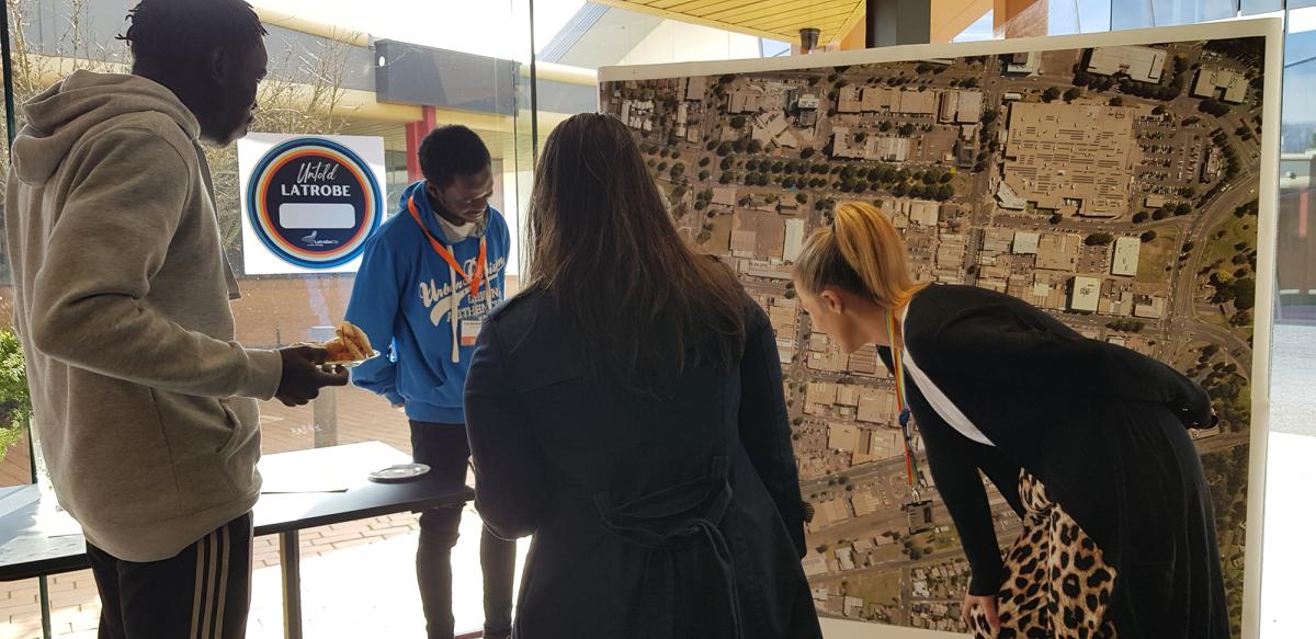 Group of people studying a map of Traralgon