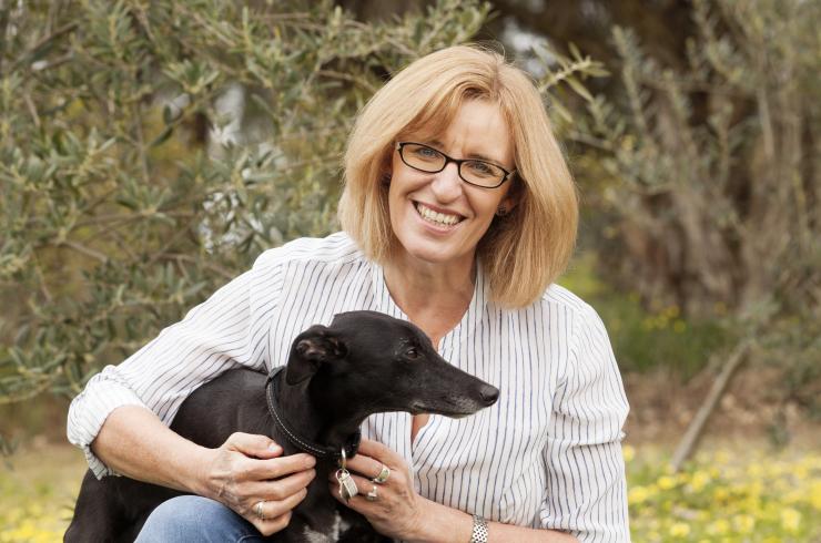 Katrina Nannestead, children's author, pictured with a small black dog
