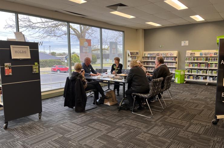 Older people sitting at a table in the Morwell Library